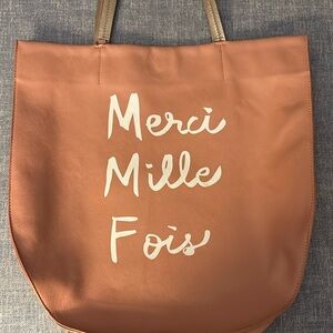 Brand new with tags Anthropologie “merci Mille fois” oversized bag.